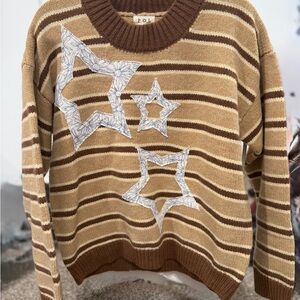 POL Women's Tan and Brown Striped Sweater with Star Accents